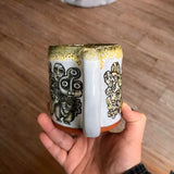 Black and Yellow Funky Faces Sleeve Mug with Black and Yellow Lip Drip