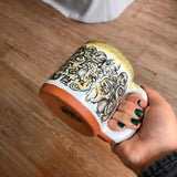 Black and Yellow Funky Faces Sleeve Mug with Black and Yellow Lip Drip