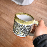 Black and Yellow Funky Faces Sleeve Mug with Black and Yellow Lip Drip