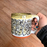 Black and Yellow Funky Faces Sleeve Mug with Black and Yellow Lip Drip